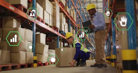 Warehouse workers analyzing digital logistics and safety data