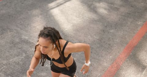 Energetic African American Woman Jogging on Urban Street - Download Free Stock Images Pikwizard.com