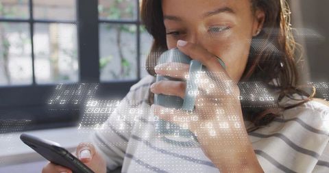 Young woman sipping mug while using smartphone with floating binary data and tech overlay