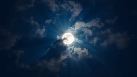 Full Moon Illuminating Clouds on Serene Night Sky