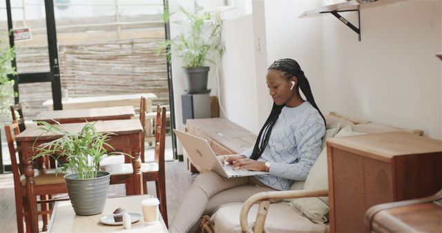 Young Woman Working Remotely in Cozy Coffee Shop - Download Free Stock Images Pikwizard.com