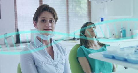 Caucasian Female Doctor with DNA Strand Overlay in Medical Environment