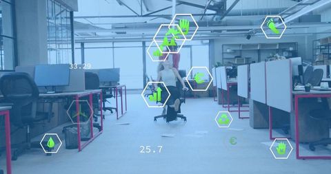 Coworkers pushing office chair in open-plan workspace with ar teamwork and eco icons