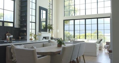 Sunlit Modern Open-Plan Living Dining with Wooden Table, Built-in Bench, Grid Windows