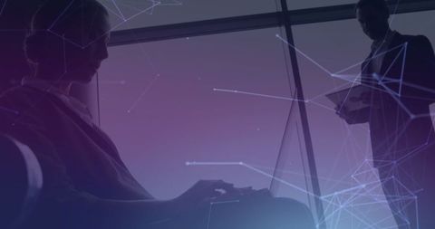 Business travelers connected through digital technology in airport lounge