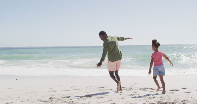 Father and Daughter Playing on Sunny Beach - Download Free Stock Images Pikwizard.com