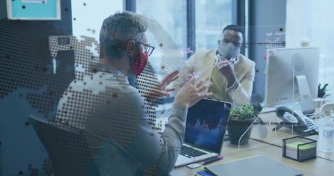 Masked Colleagues Collaborating Over Data at Workspace