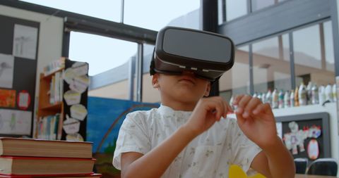 Asian Schoolboy Using Virtual Reality in Classroom