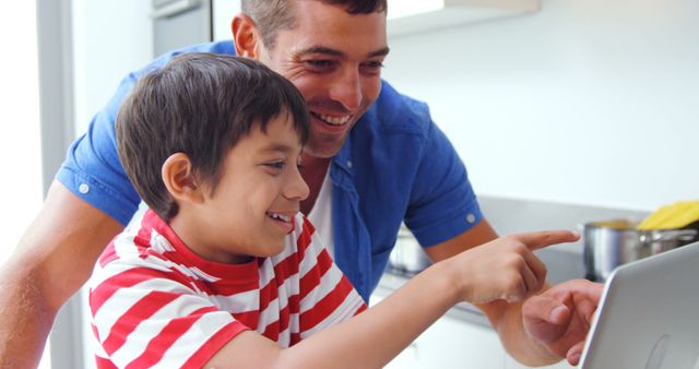 Happy Father and Son Bonding on Laptop at Home - Download Free Stock Images Pikwizard.com