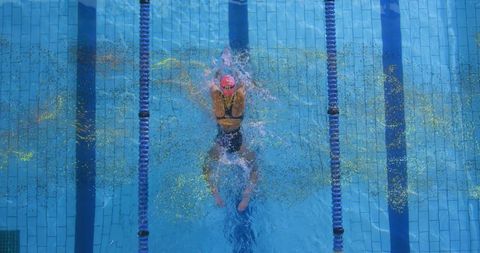 Competitive Breaststroke Swimmer in Action