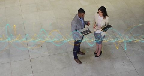 Business Professionals Analyzing Data with Digital Interface Hologram