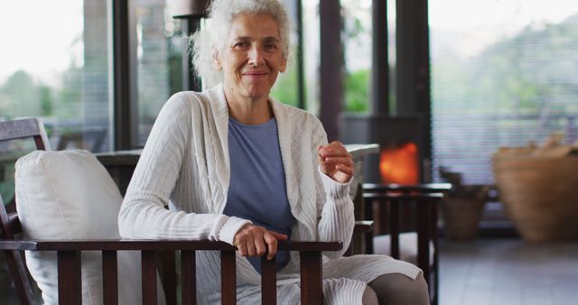 Smiling Elderly Woman Relaxing in Modern Living Room - Download Free Stock Images Pikwizard.com