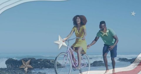 Joyful African American Couple Enjoying Beach Bicycle Ride