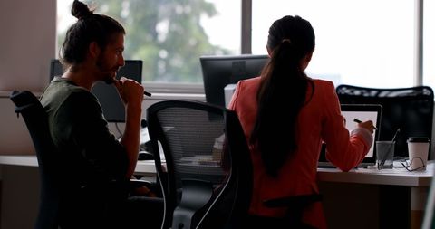 Business team collaborating at workspace with sunshine