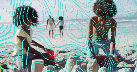 Children Enjoying Sandcastle Building on Summer Beach