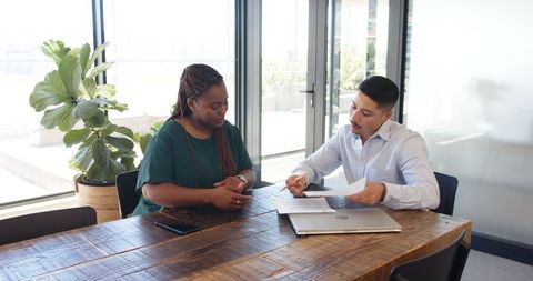 Business Colleagues Discussing Project in Modern Office Environment