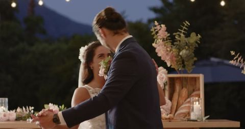 Newlyweds Laughing During Romantic Wedding Dance Outdoors