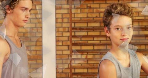 Two Brothers Practicing Dance in Urban Studio with Barre