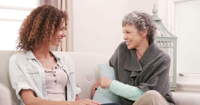 Friendly Conversation Between Two Multigenerational Women on Couch - Download Free Stock Images Pikwizard.com