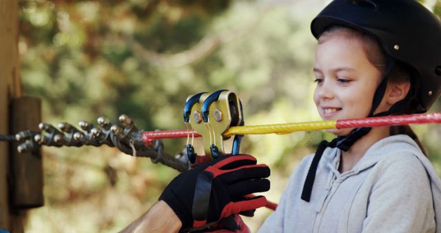 Young Girl Enjoying Zip Line Adventure in Helmet - Download Free Stock Images Pikwizard.com