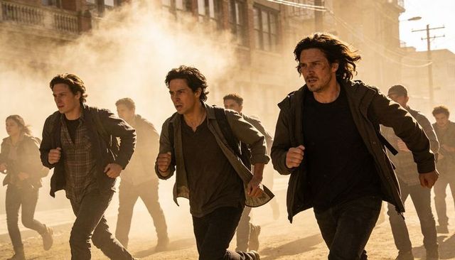 Young men sprinting through dusty urban street at dusk fleeing danger and chaos, urgent escape