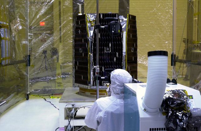 In a clean-room environment at North Vandenberg Air Force Base, a technician monitors the AIM spacecraft after illumination testing on the spacecraft's solar array panels. The AIM spacecraft will fly three instruments designed to study those clouds located at the edge of space, 50 miles above the Earth's surface in the coldest part of the planet's atmosphere. The mission's primary goal is to explain why these clouds form and what has caused them to become brighter and more numerous and appear at lower latitudes in recent years. AIM's results will provide the basis for the study of long-term variability in the mesospheric climate and its relationship to global climate change. AIM is scheduled to be mated to the Pegasus XL during the second week of April, after which final inspections will be conducted. Launch is scheduled for April 25.