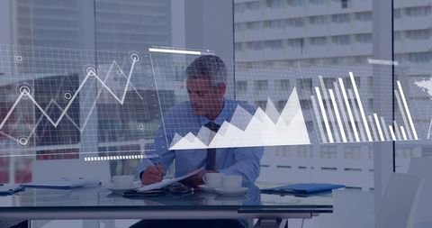 Businessman Analyzing Data in Modern Office with Digital Interface