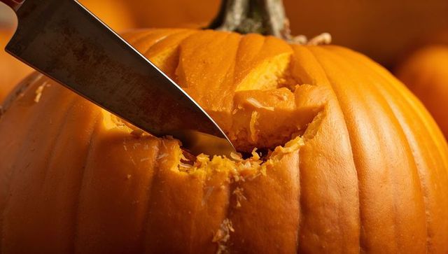 Close-up pumpkin carving preparing halloween decorations