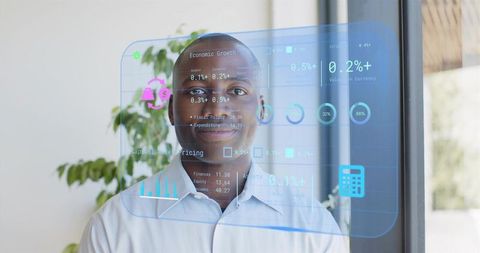 Corporate analyst viewing holographic finance dashboard on glass wall for data strategy