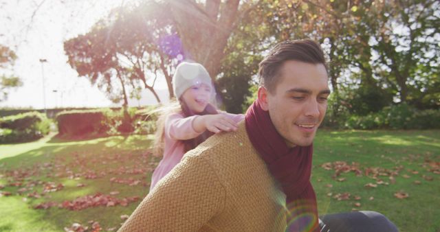 Father and Daughter Playing Outdoors in Autumn Sunlight - Download Free Stock Images Pikwizard.com