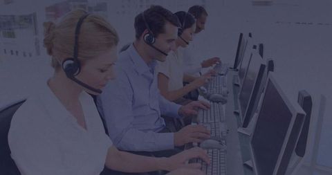 Customer Service Team Using Headsets in Modern Office Workspace