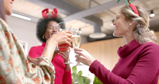 Diverse coworkers enjoying holiday celebration with festive drinks - Download Free Stock Images Pikwizard.com