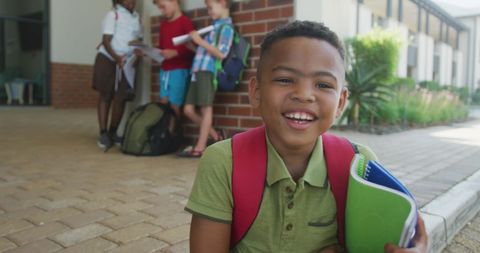 Happy Boy Excited for School Holding Notebooks Outdoors - Download Free Stock Images Pikwizard.com