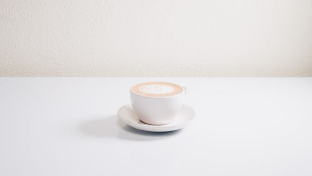 Minimalist White Cup of Coffee on Clean White Table - Download Free Stock Photos Pikwizard.com