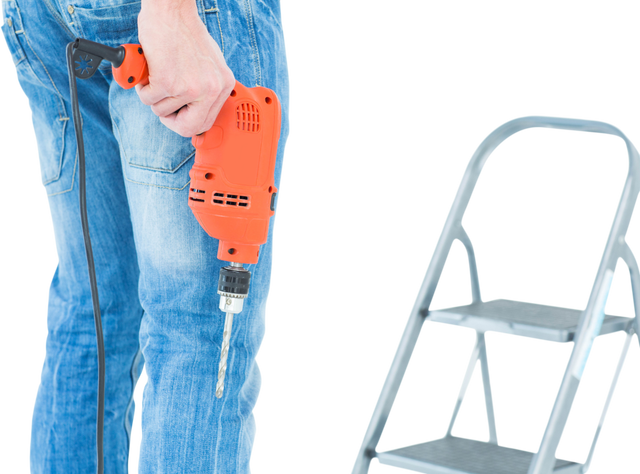 Worker Holding Electric Drill in Front of Step Ladder Transparent Setup - Download Free Stock Videos Pikwizard.com