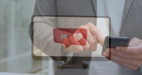 Businessman checking social media notifications in office
