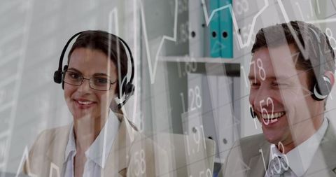 Business Professionals Collaborating with Financial Graphs in Office