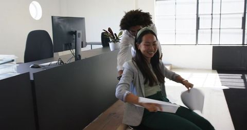 Colleagues Having Fun in Modern Office Space