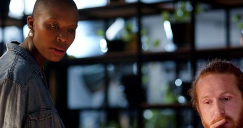 Colleagues Engaging in Late Night Office Discussion