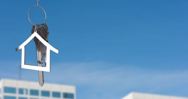 Silver House Key Dangling Against Blue Sky in Urban Setting - Download Free Stock Images Pikwizard.com