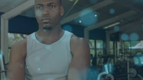 Focused Athlete Working Out with Kettlebell at Gym