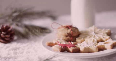 Festive Christmas Cookies on Snowy Surface with Milk - Download Free Stock Images Pikwizard.com