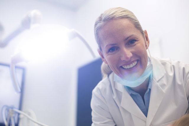 Portrait of smiling female dentist in dental clinic
