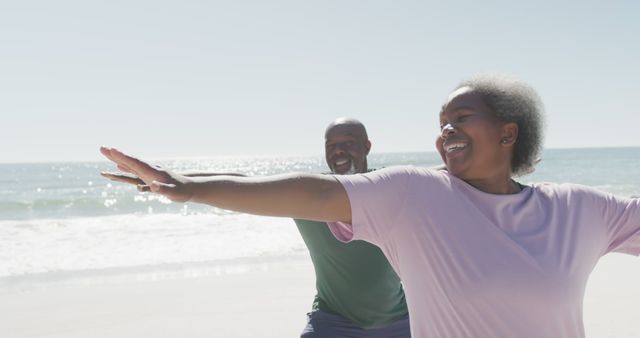 Senior Couple Doing Yoga Poses on Beach Under Bright Sun - Download Free Stock Images Pikwizard.com