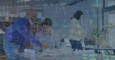 Diverse professionals collaborating on architectural design in modern office