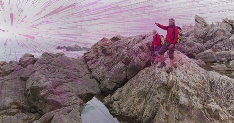 Adventurous hikers exploring rocky coast in warm attire
