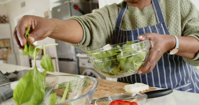 Person Preparing Fresh Salad in Kitchen - Download Free Stock Images Pikwizard.com