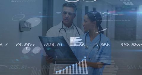 Doctors Analyzing Data with Technology in Hospital