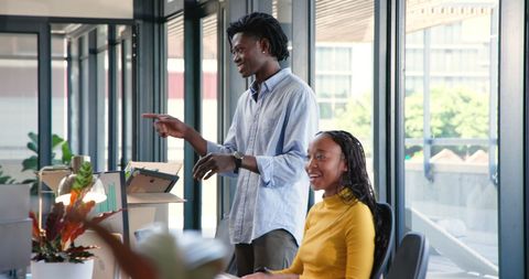 Young Professionals Brainstorming Together in Modern Office