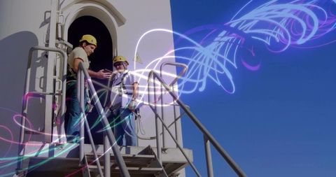 Technicians Examining Data on Tower Landing with Energetic Ingenuity